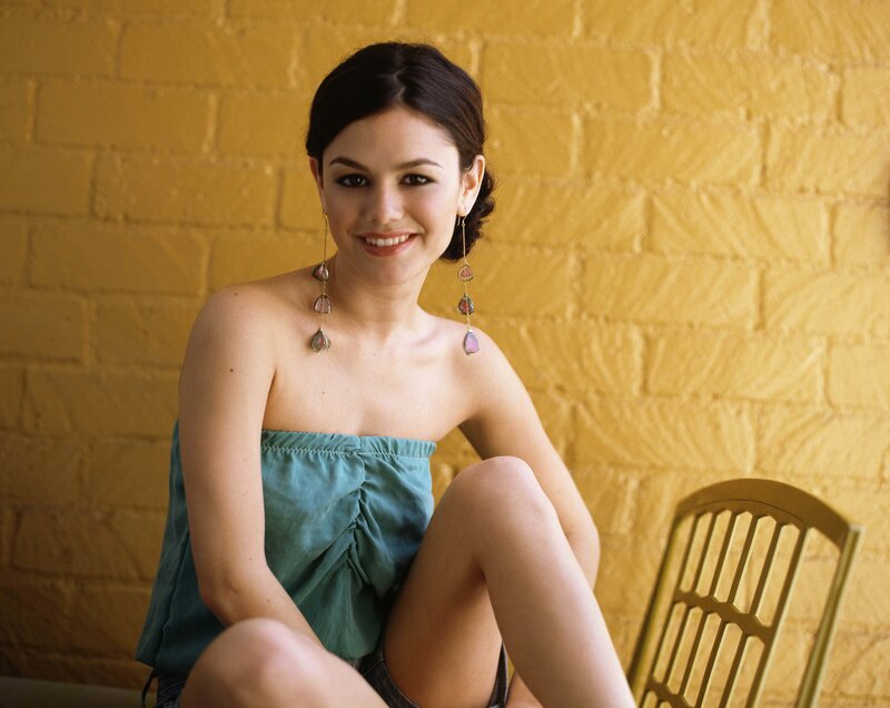 woman in green top smiling