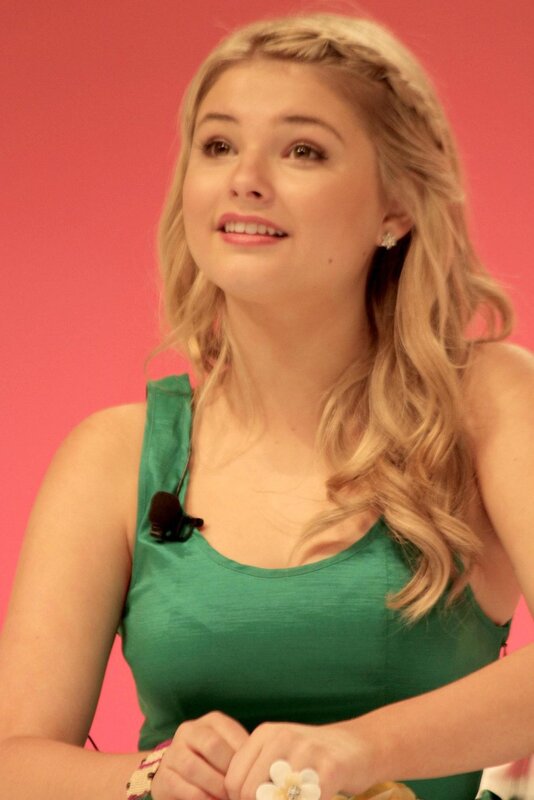 woman in green top smiling