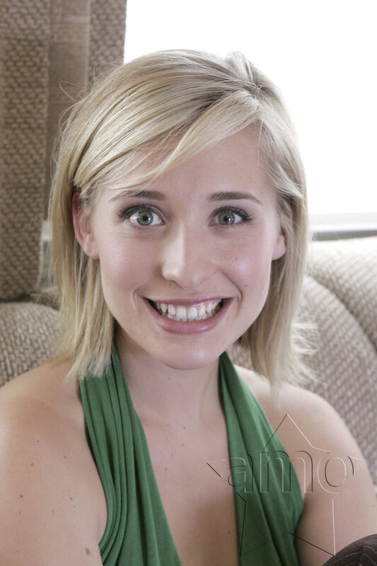 woman in green top smiling