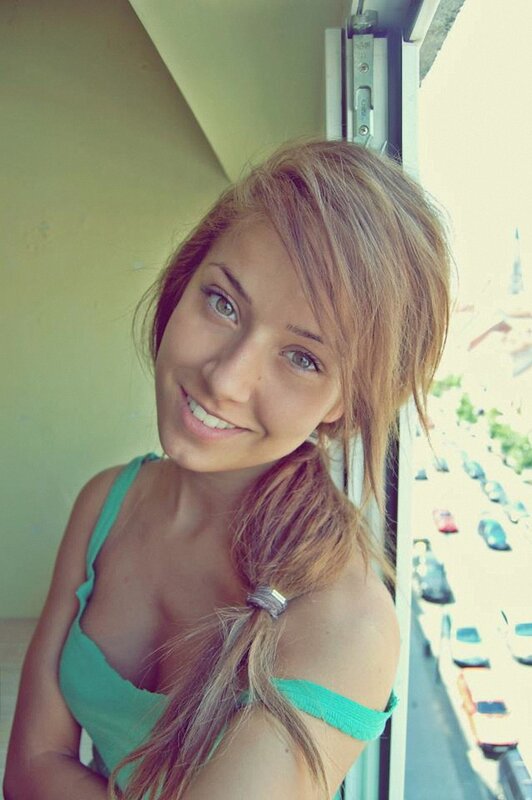 woman in green top smiling