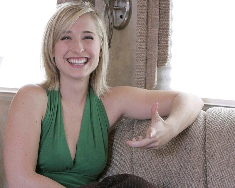 woman in green top smiling