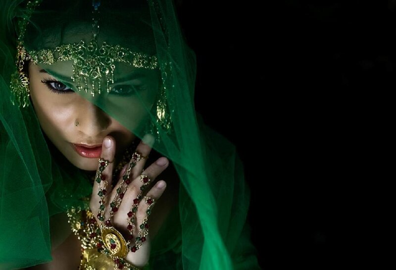 woman in green veil with jewelry