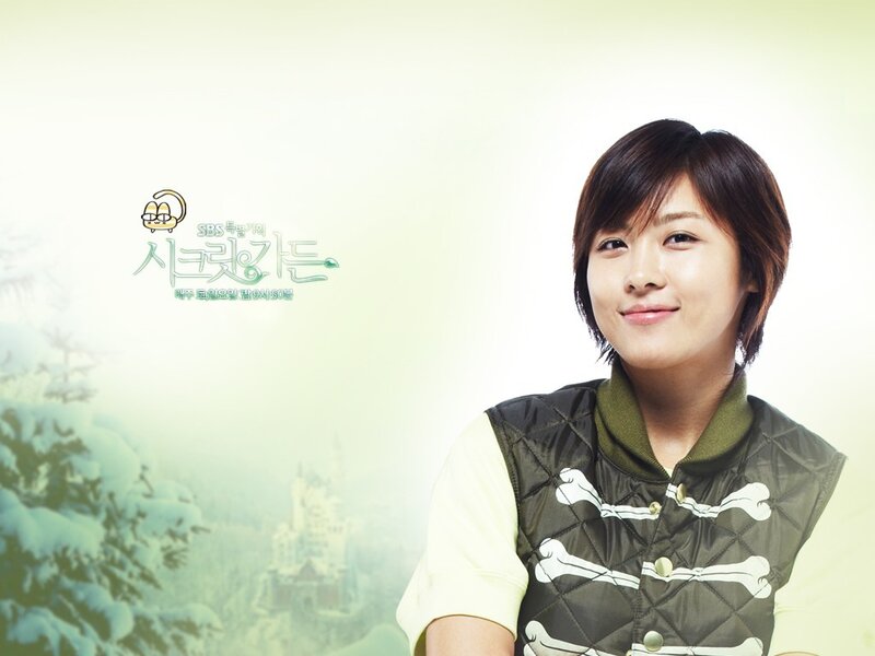 woman in green vest smiling