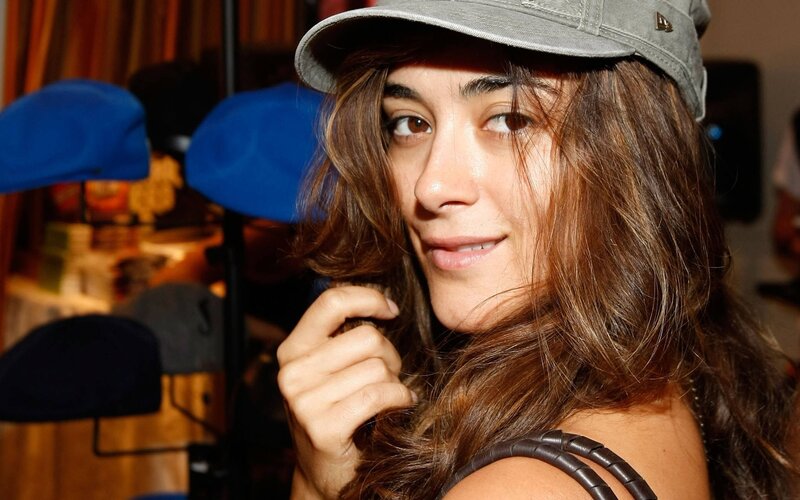 woman in grey cap smiling