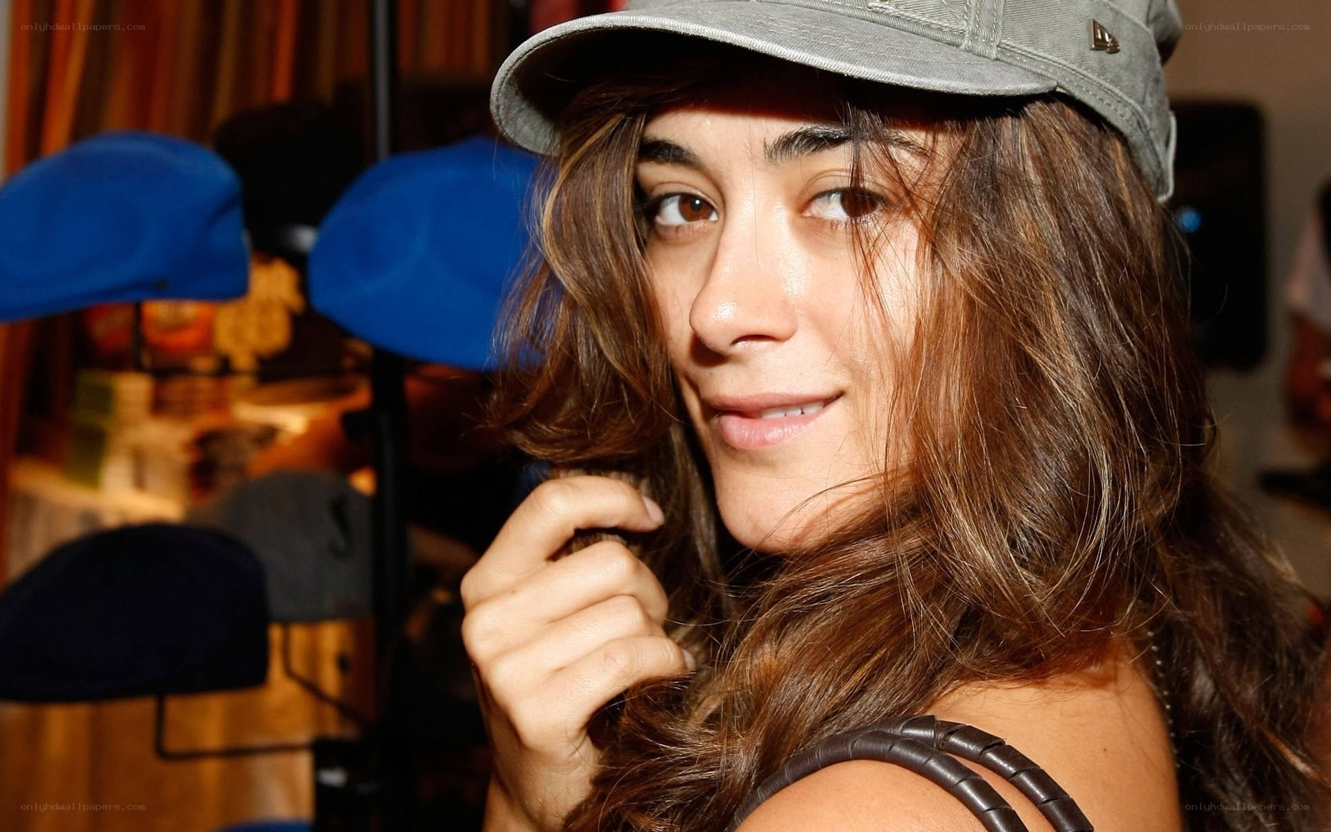 woman in grey cap smiling