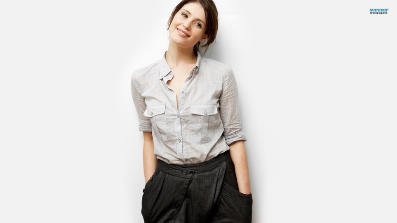 woman in grey shirt smiling