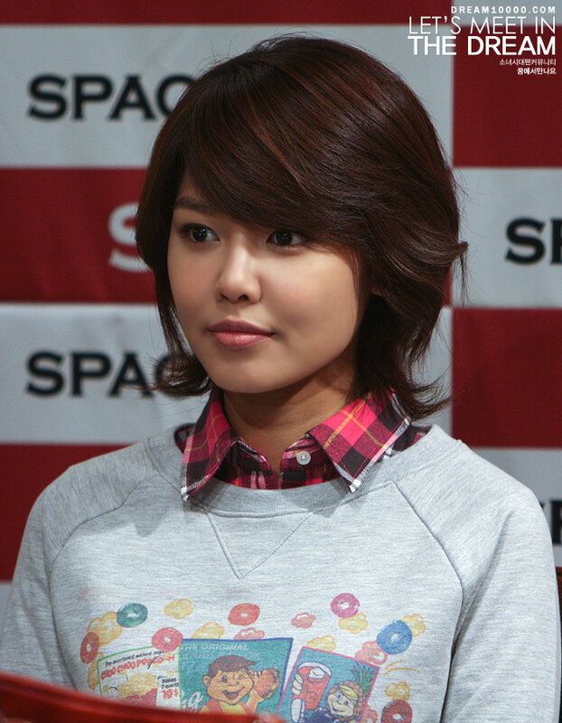 woman in grey sweatshirt