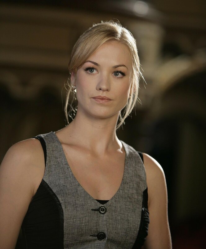 woman in grey vest
