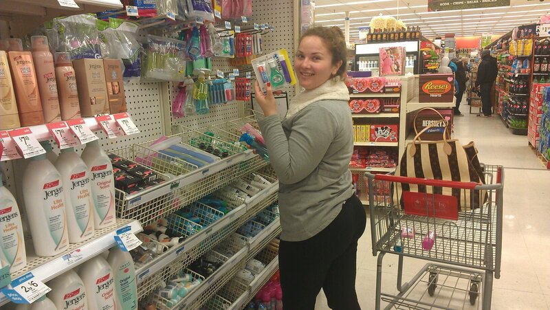 Woman in Grocery Store — Gray