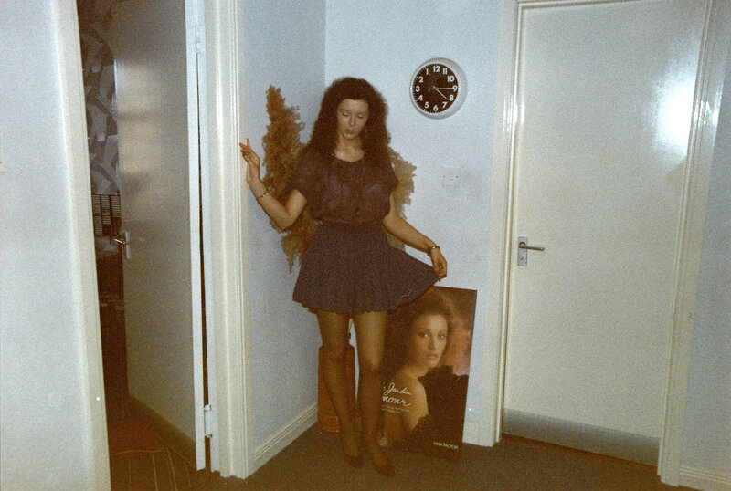 Woman in hallway with poster