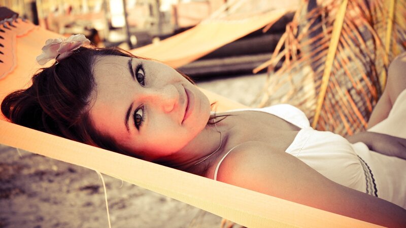 woman in hammock at beach