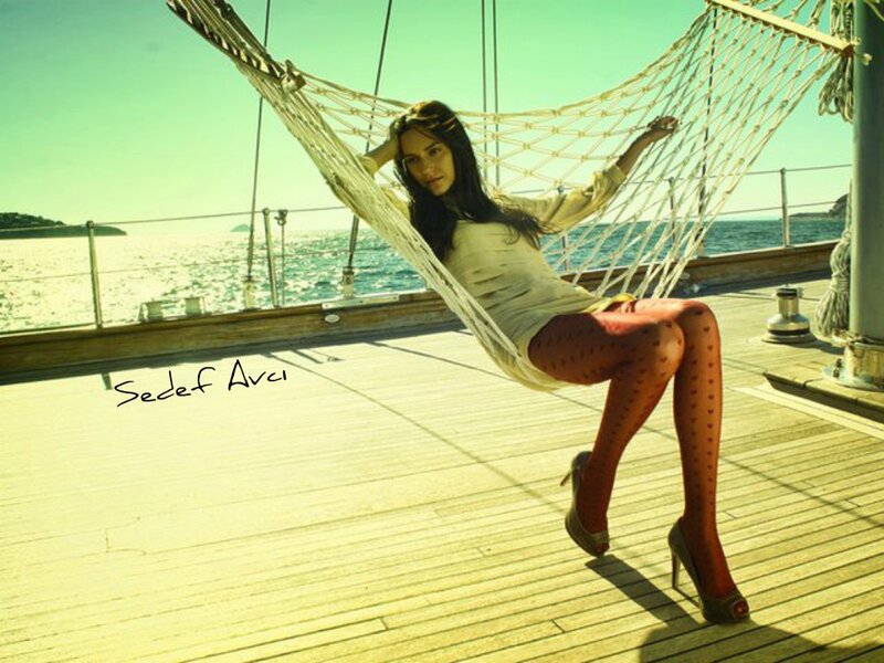 Woman in hammock on yacht