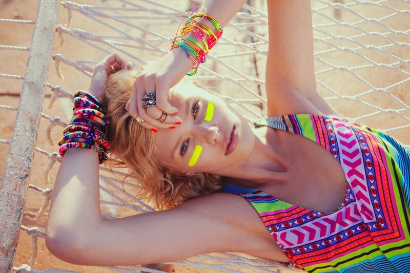 woman in hammock with colorful accessories