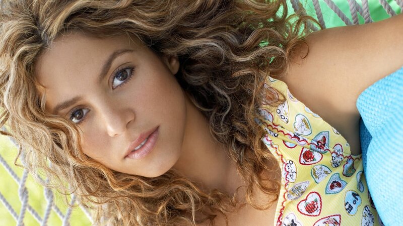 woman in hammock with curly hair
