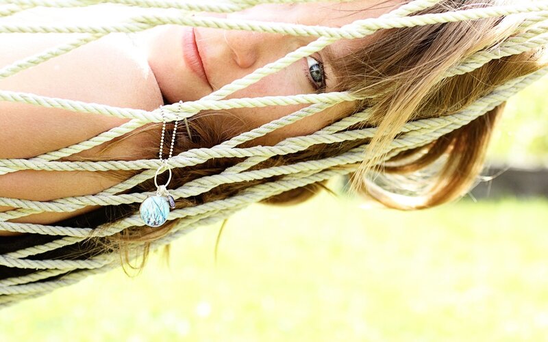 woman in hammock with necklace