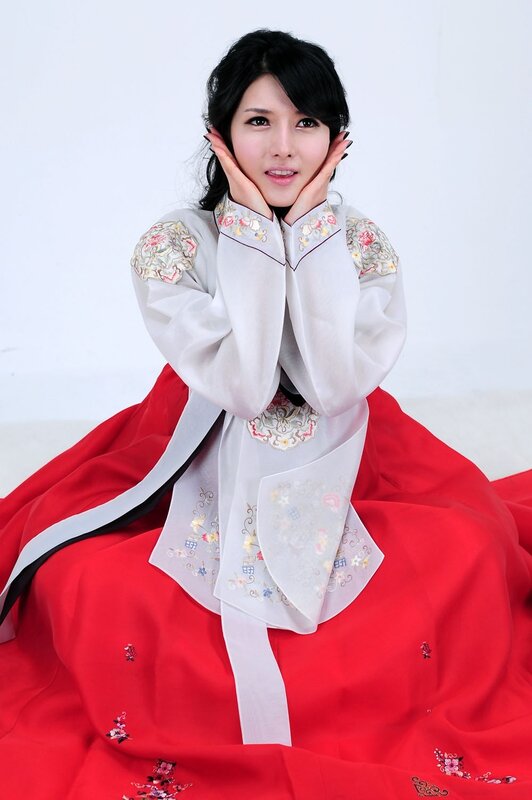 Woman in Hanbok — Red, Calm, Photograph, Dress, Hands