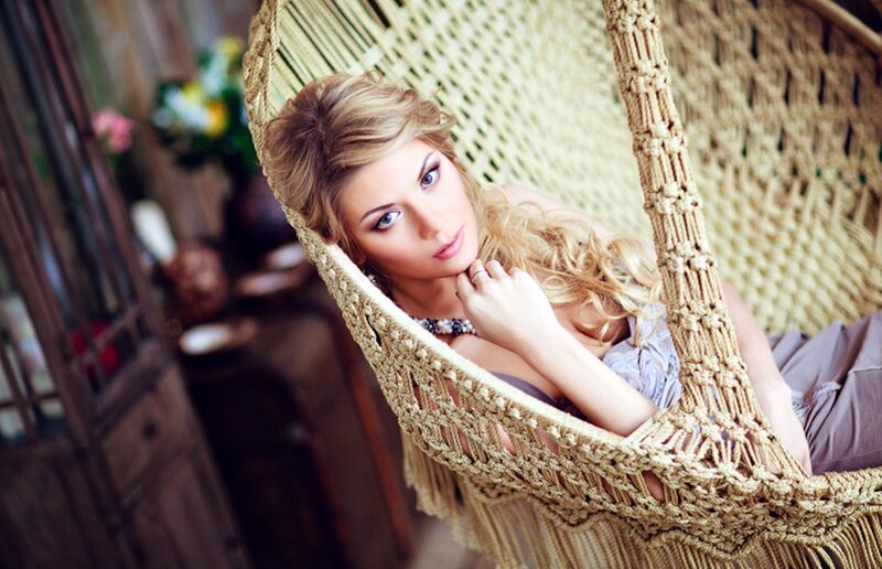 Woman in Hanging Chair