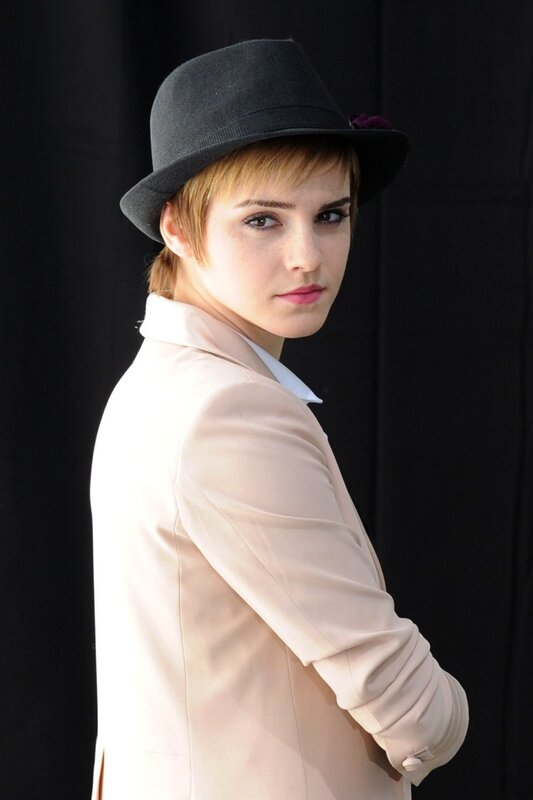 woman in hat and blazer