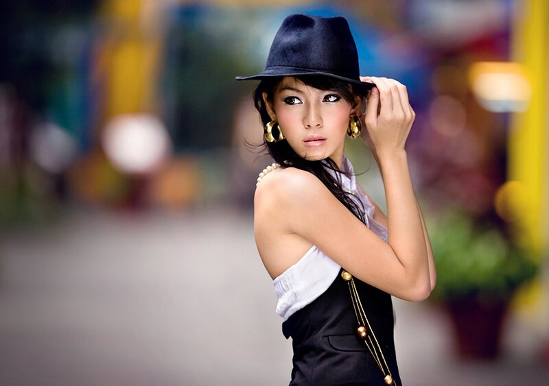 woman in hat and earrings