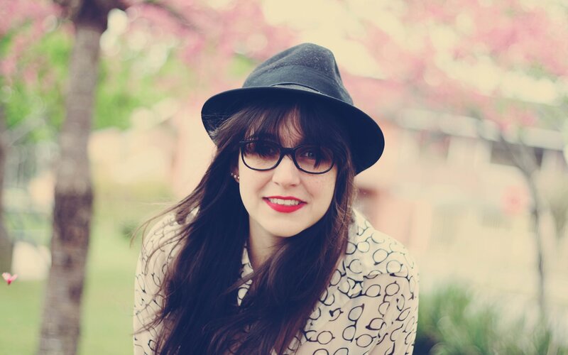 woman in hat and glasses