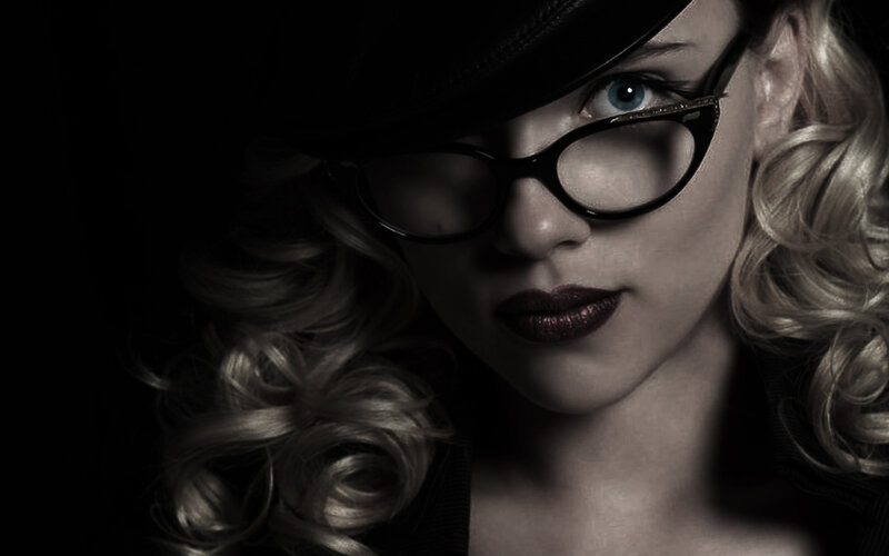 woman in hat and glasses