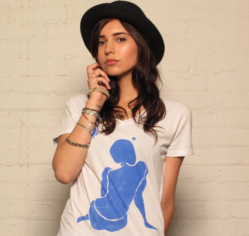 woman in hat and graphic tee