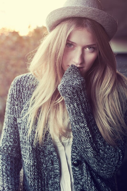 woman in hat and knit sweater