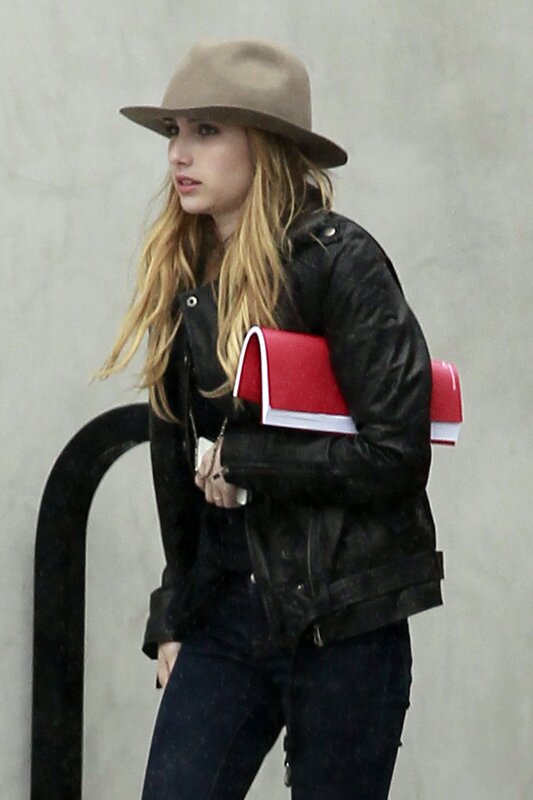 woman in hat and leather jacket