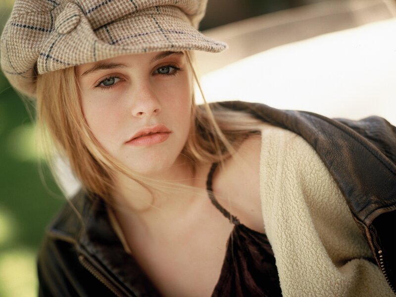 woman in hat and leather jacket