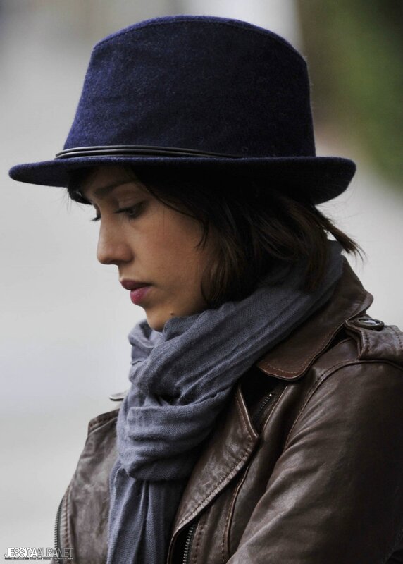 woman in hat and leather jacket