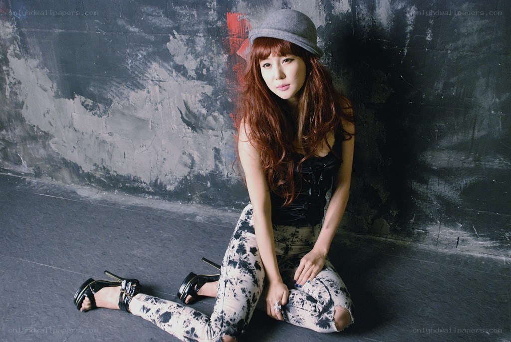 woman in hat and patterned pants