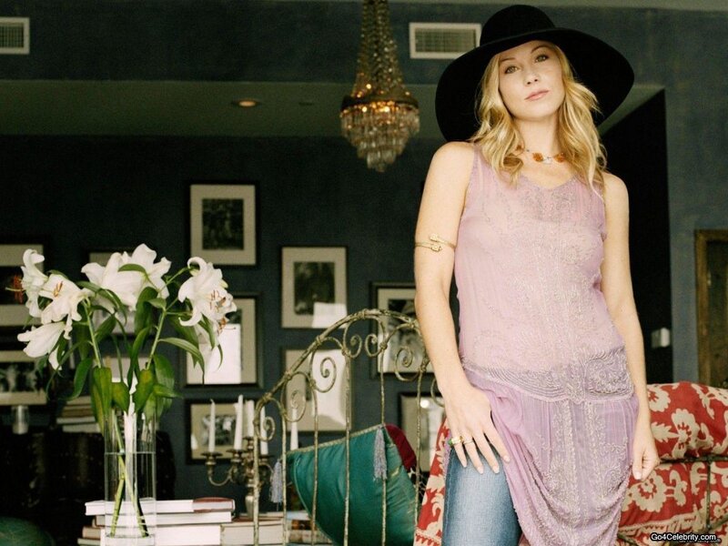 Woman in Hat and Purple Top
