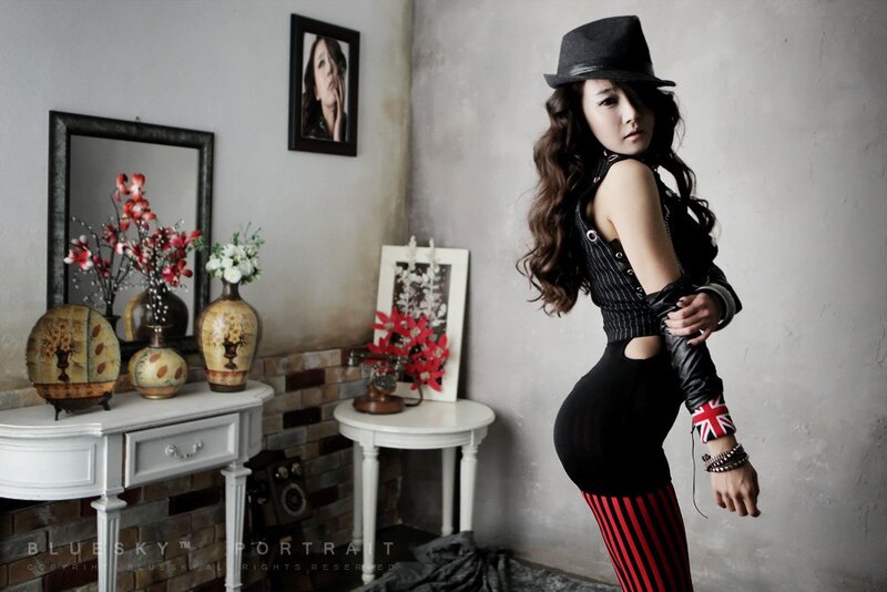 woman in hat and striped leggings