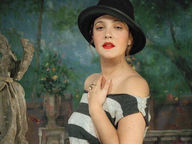 woman in hat and striped top