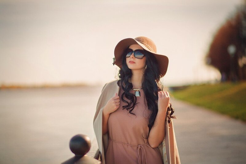 Woman in Hat and Sunglasses — Brown