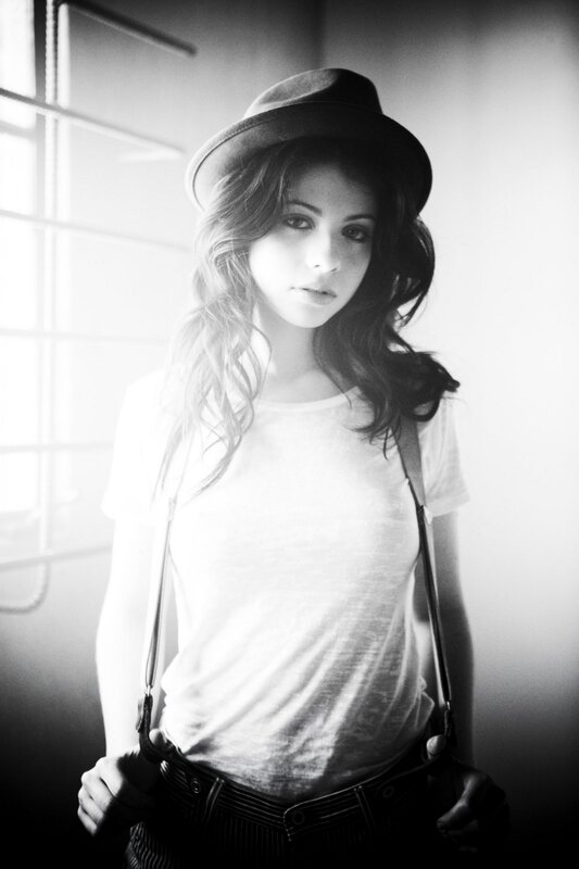 woman in hat and suspenders