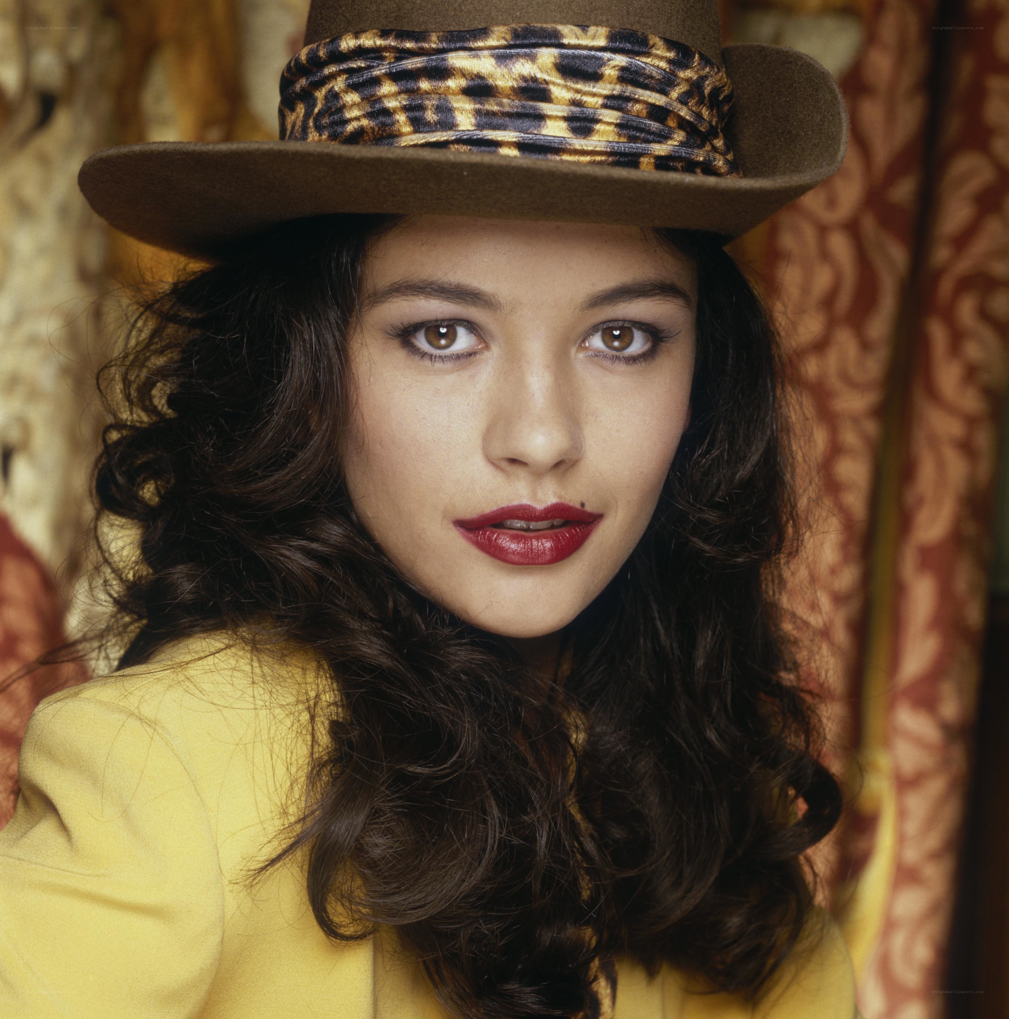 woman in hat and yellow jacket