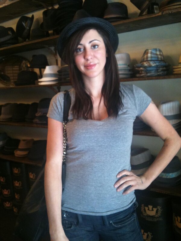 woman in hat at a shop