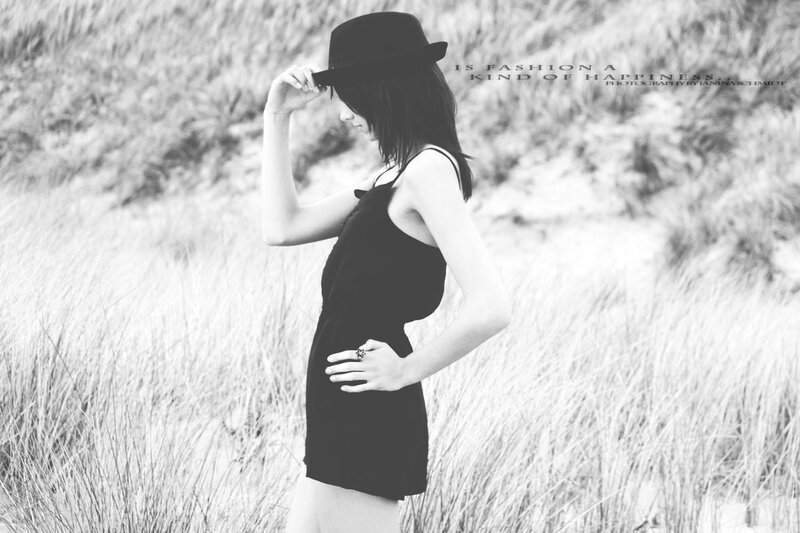 woman in hat at beach