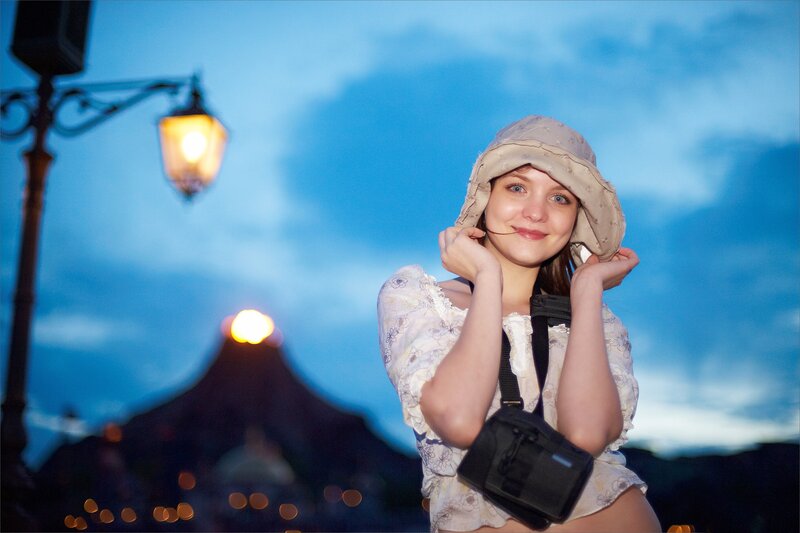 Woman in hat at dusk