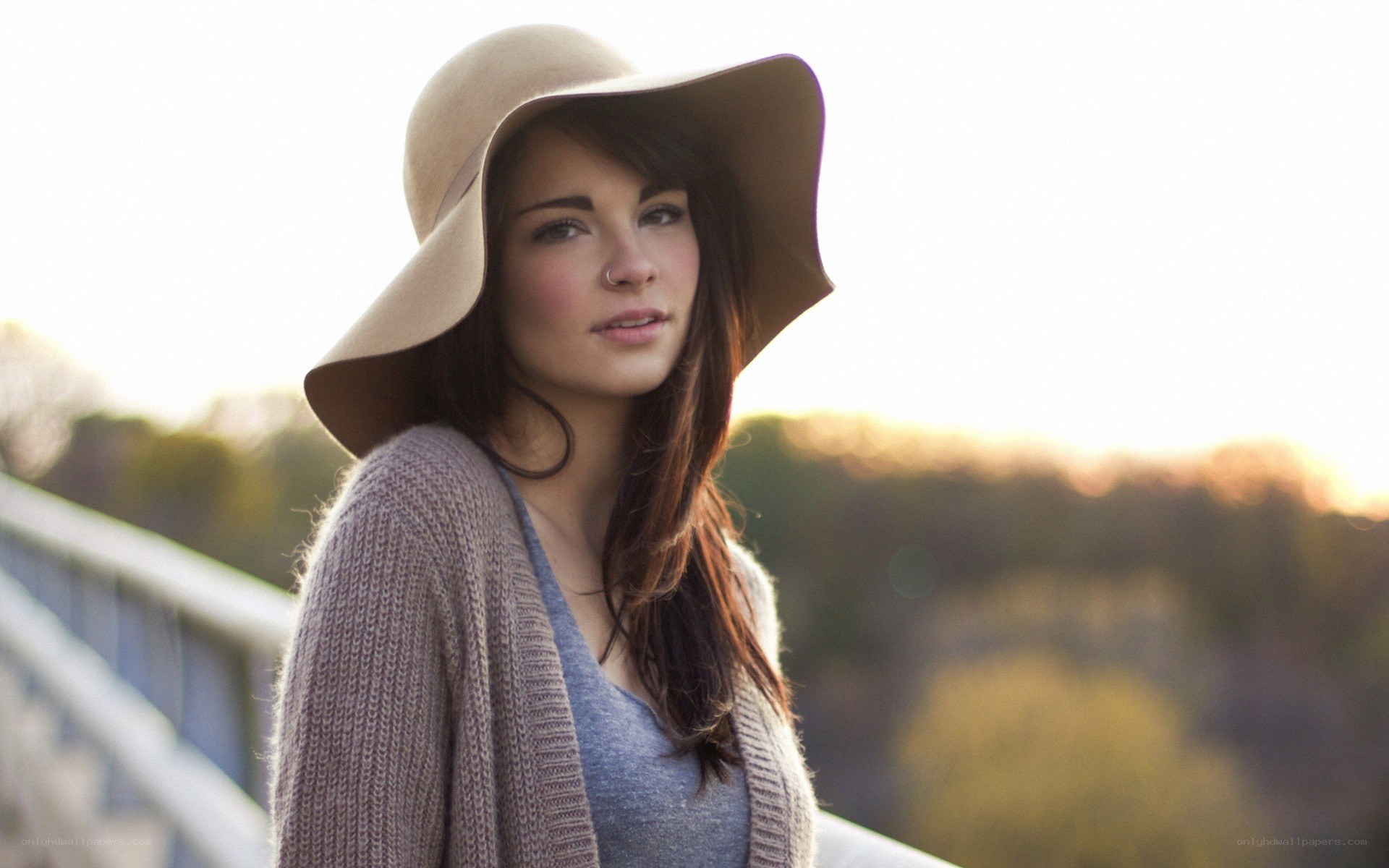 woman in hat at sunset