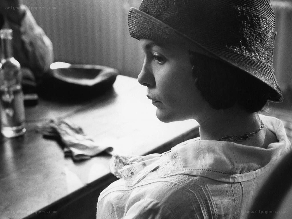 woman in hat at table