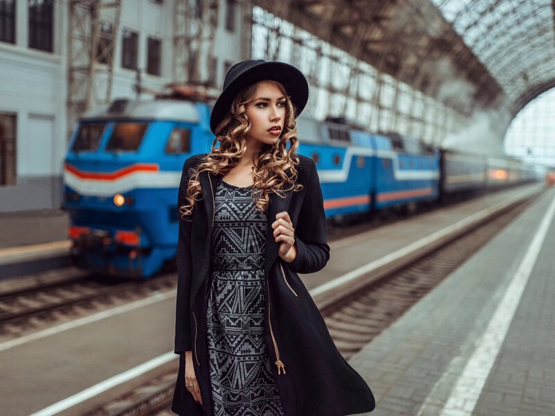 Woman in Hat at Train Station