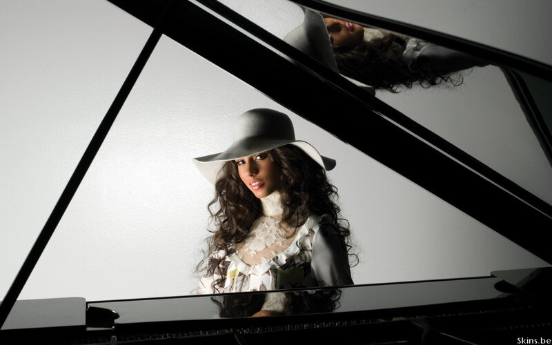 woman in hat by piano