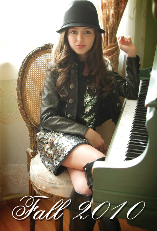 Woman in hat by piano