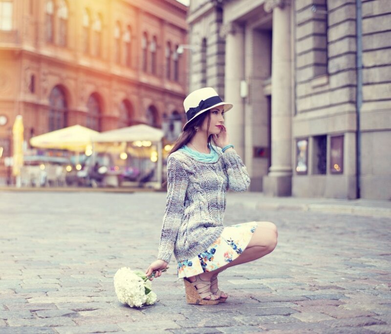 Woman in Hat Crouching — White