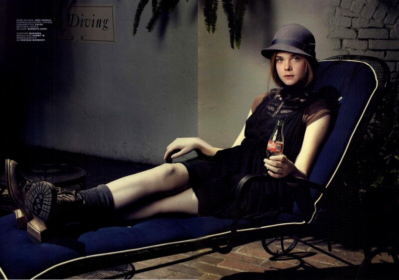 woman in hat holding coca-cola
