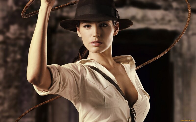 Woman in Hat Holding Whip