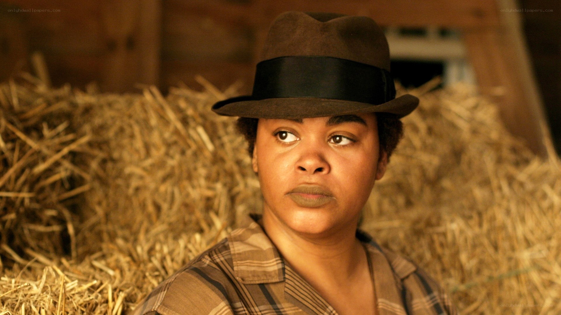 woman in hat in barn