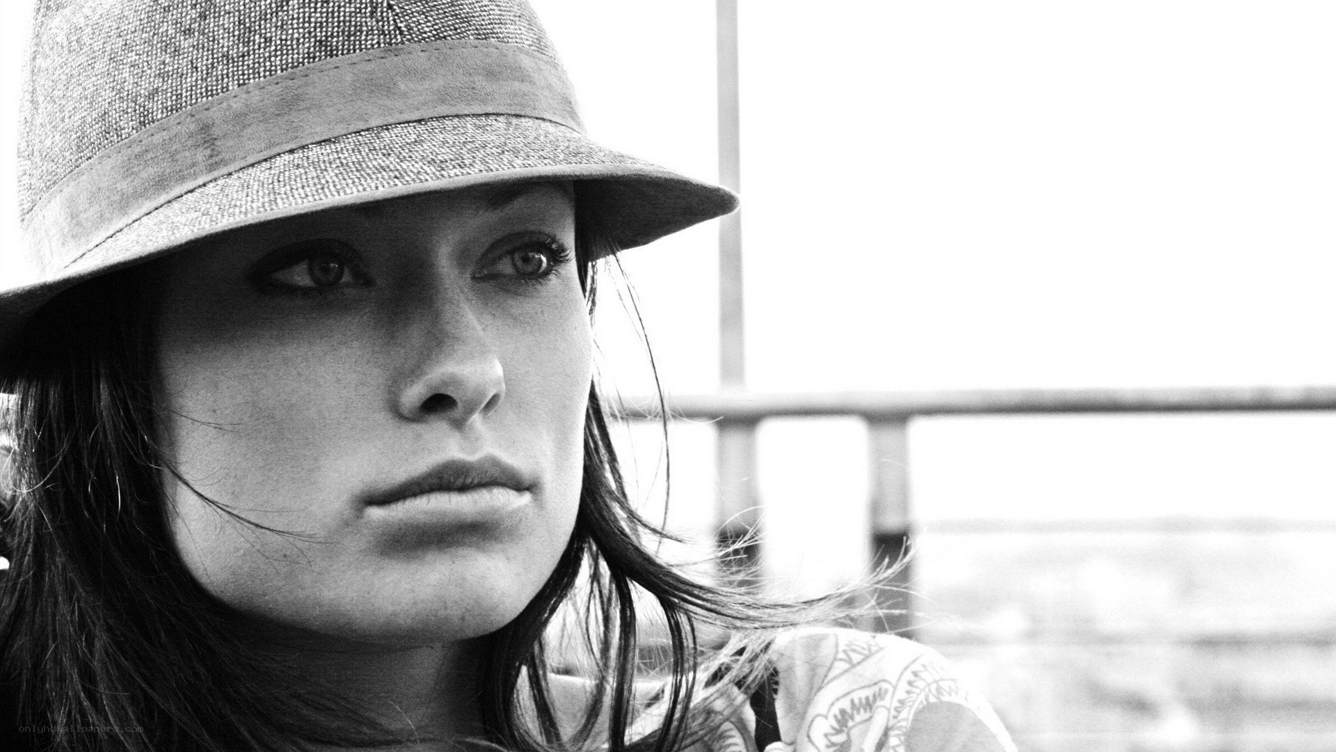 woman in hat looking away